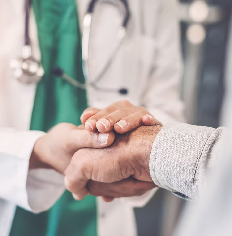 provider holding patients hand